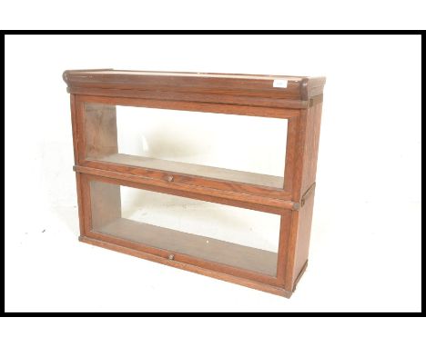 A pair&nbsp; / stack of Globe Wernicke manner lawyers stacking bookcases. Each of golden oak construction having lift over gl