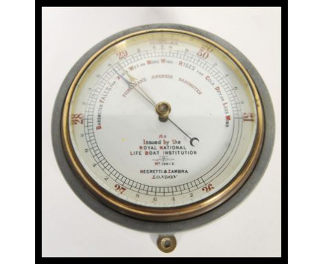 A vintage 20th Century Negretti &amp; Zambra circular cased fisherman's aneroid barometer issued by The Royal National Lifebo