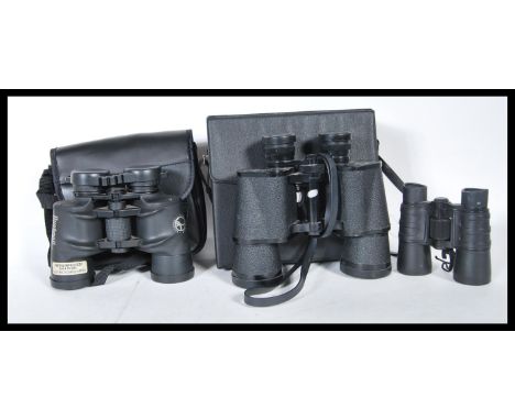 A group of three binoculars to include, a pair of Tasco fully coated lightweight binoculars in original case model no.313, a 