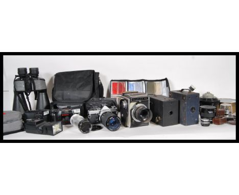 A small collection of 20th Century cameras and camera lenses to include, Corfield 66 having Lumax lens, Olympus OM-1 camera h