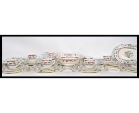 A 20th century Spode ceramic dinner service in the ' Indian&nbsp; Tree ' pattern. Comprising dinner plates, cups, saucers etc