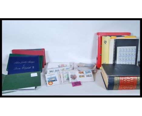 A collection of world stamps and first day covers dating from the early 20th Century to include stamps from Canada, Belgium, 