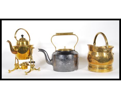 A collection of 20th century brass items to include a brass spirit kettle on stand with burner, a cast iron teapot marked to 