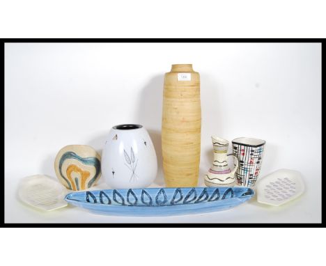 A group of mid 20th Century studio pottery to include, a bolubs vase having white ground with original label Flor Plateel Gou