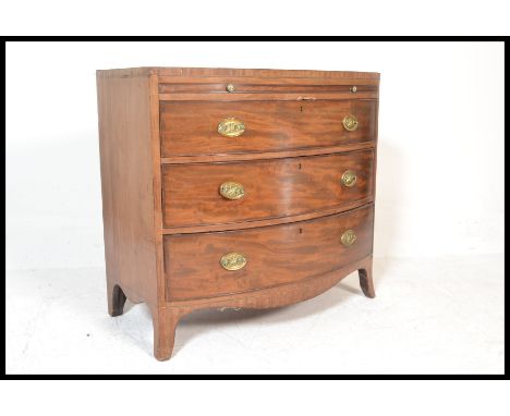 A 19th Century Georgian mahogany bow front chest of three graduating drawers&nbsp; with pull slide brushing slide above. All 