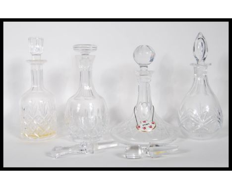 A group of 20th Century cut crystal glass decanters to include, a ships decanter having round cut ball stopper. Together with