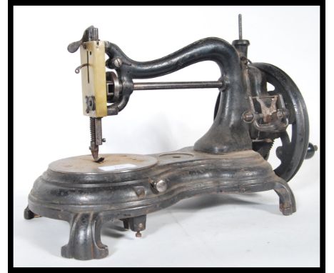 A late 19th century&nbsp; sewing machine of C arch form in the manner of&nbsp; Willcox&nbsp;&amp; Gibbs.Measures 25cm x 35cm 