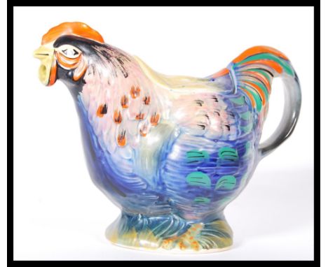 A early 20th Century 1920's novelty teapot in the form a rooster having bright coloured feathers. Patent number 301262 made i