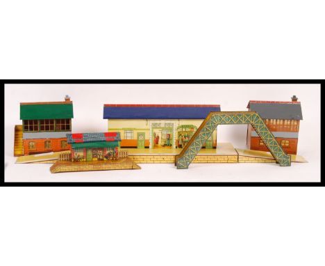 A collection of five 1940's Hornby Series 0 Gauge litho printed tin train set model railway trackside buildings and accessori