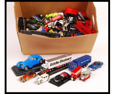 A collection of assorted scale diecast model vehicles to include; Matchbox, Atlas, Hot Wheels, Lledo Days Gone, Bburago / Bur