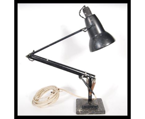 A 20tyh Century 1940's Industrial pre-war Herbert Terry anglepoise lamp, raised on a cast metal two step base with pendant sh