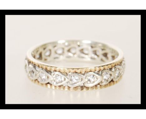 A 9ct gold 375 full eternity ring having white stones. Assay marks for Birmingham, date letter M. Weighs 3.3g. Size P.&nbsp; 