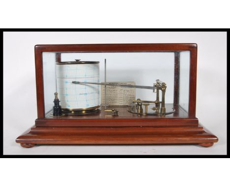 A late 19th / early 20th Century, barograph in glazed mahogany case with chart drawer, Retailers plaque to the inside for J.T