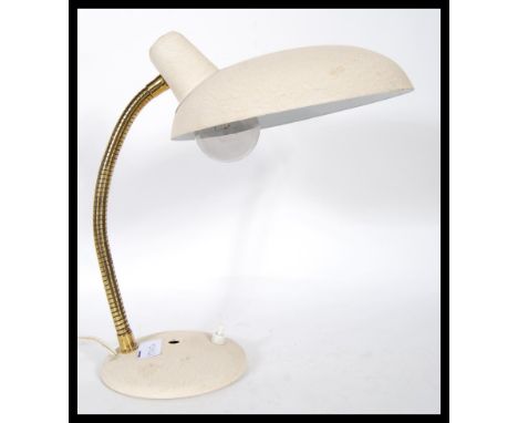 A vintage mid 20th Century gooseneck desk lamp, set to a circular base with inset switch gilt gooseneck terminating with adem