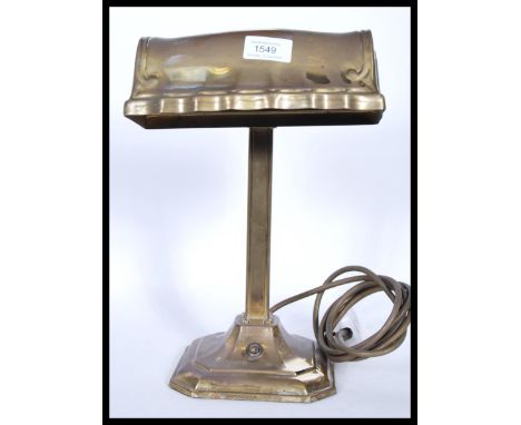 A good 20th century brass bankers desk lamp raised on a terraced square base and brass shade atop.&nbsp;