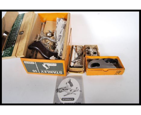 A 20th Century Stanley Combination plane No.50 complete with cutting tools shaving deflector and bottom adjusting screw. Toge