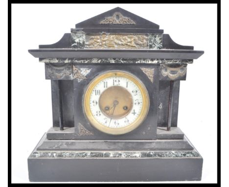 A 19th Century Victorian slate marble mantel clock raised on a large pedestal stepped base with gilt brass dial, white enamel