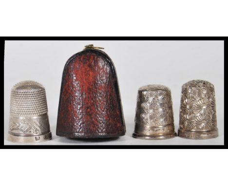 A group of three silver hallmarked thimbles to include a Charles Horner thimble within a fitted Hogg &amp; Shaw box, a James 