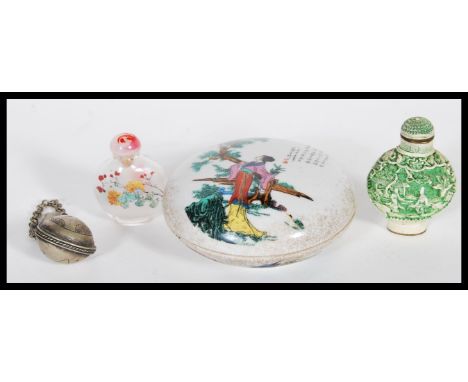A collection of three Chinese snuff bottles to include a white metal one with naive chase decoration to the body, a glass one