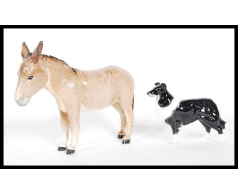 A vintage 20th Century Beswick ceramic figurine modelled as a Donkey stamped to the underside together with a Beswick ceramic