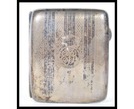 A early 20th Century silver hallmarked cigarette case, having engine turned decoration to front and verso, with push button c