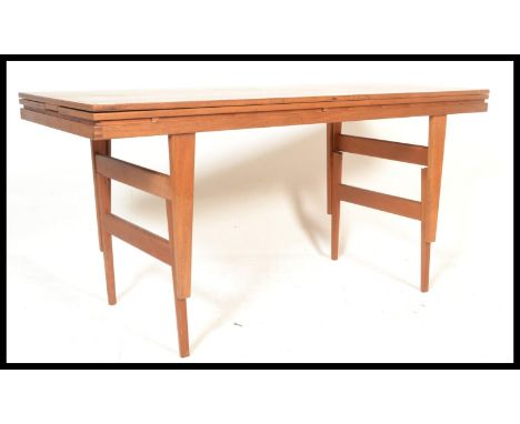 A stunning mid 20th Century teak wood Danish adjustable metamorphic dining / coffee table, possibly by&nbsp;Kai K Ristiansen 