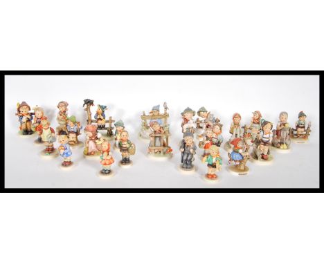 A collection of vintage German mid to late 20th Century Goebel Hummel ceramic figurines of children, over 20 figures.&nbsp;