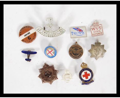 A collection of vintage 20th Century badges to include, an enamel National League of Airmen, enamel Red Cross, W.V.S Civil de