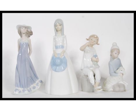 A collection of three 20th Century Spanish Lladro ceramic&nbsp;figurines modelled as young girls together with another simila