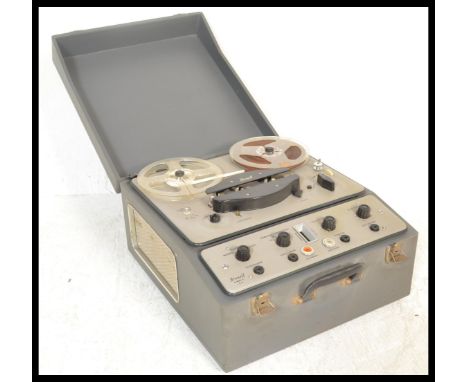 A vintage 20th Century Brenell MK5 reel to reel tape recorder, housed in it's own carry case with lift off front, hammered en