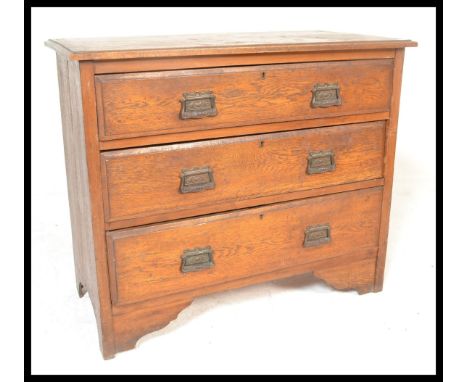 An early 20th Century Art Deco vintage dressing chest of drawers. The bank of three straight drawers having drop swing decora