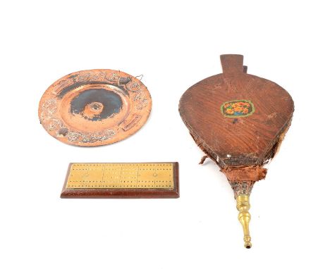Two Victorian copper warming pans, each with ebonised handles, pair of bellows, ladle, horse brasses, and other metalware.