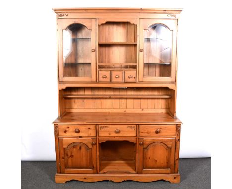 Modern pine dresser, moulded cornice, the upper section with open shelf above spice drawers, flanked by glazed doors, the bas