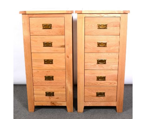 Contemporary light oak bedroom furniture, including double wardrobe, two panelled doors enclosing a hanging rail, drawer base