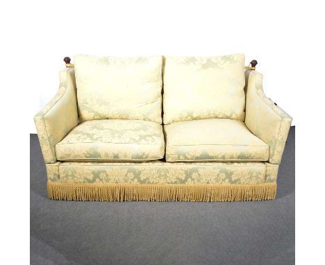 Knole sofa, shaped wings with turned beech finials, green and gold cotton upholstery, width 186cm, depth 108cm, height 97cm.