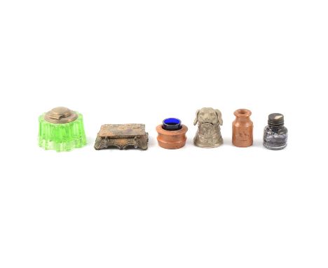 A collection of inkwells, including one silver mounted, numerous glass and ceramic, oak desk stand, etc.