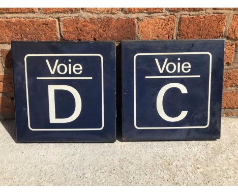 Two original French road/railway station enamel signs, Voie D and Voie C, blue ground and white text, both 32cm by 32cm.