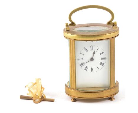 French brass cased carriage clock, oval section, white enamelled dial with Roman numerals, nine-piece movement with platform 