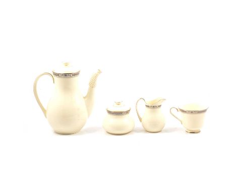 A Royal Doulton ‘Melissa’ pattern dinner and coffee service, ten-place settings, comprising lidded tureens, serving bowls, me