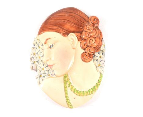 A Beswick Ware Art Deco portrait wall plaque, depicting a young woman with red hair, green beads and hyacinths, impressed num