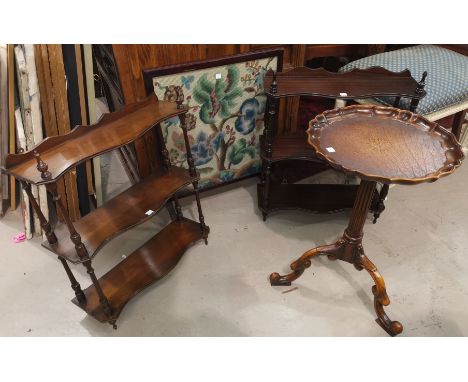 Two reproduction mahogany wall hanging whatnots; a similar wine table; a needlework firescreen 