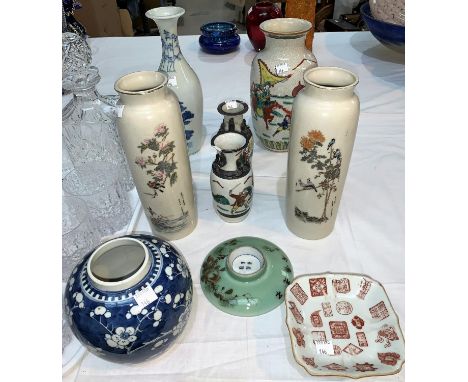 A 20th century Chinese pair of cylindrical vases decorated with flowers and texts, red seal mark to bases, height 25 cm; 2 Ch