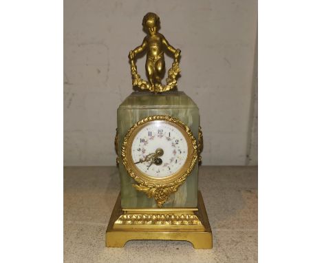 An ormolu and onyx small mantel clock in the Louis XVI style with cherub finial, floral painted enamel dial and French balanc