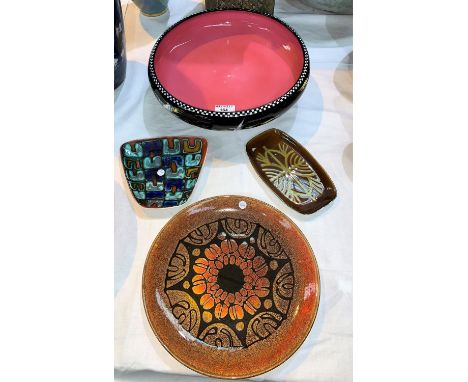 A 1930's shallow bowl decorated with geese in flight, diameter 31 cm; 3 pieces of 1970's Poole pottery 