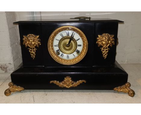 A 19th century clock in black marble architectural case, with gilt metal mounts and French striking movement, height 24 cm 
