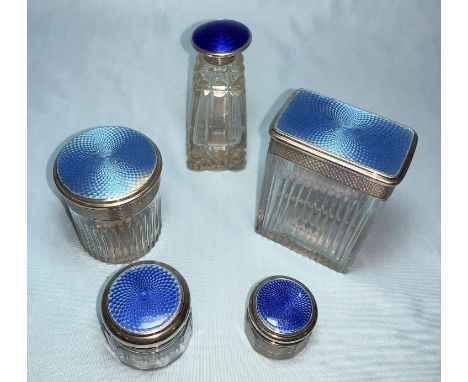 A cut glass rectangular jar with blue enamel silver top; a matching circular pot, Birmingham 1928; 3 others; a hatpin (unmark