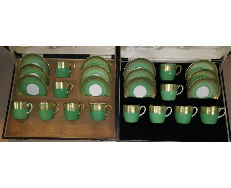 A set of 6 Cauldon bone china coffee cups and saucers, gilt on green ground, cased; a similar set (1 saucer a.f.) 