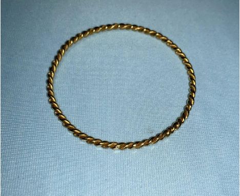 An Egyptian yellow metal rope twist marriage bangle, bearing Egyptian hallmarks, tests as circa 22 ct, 16 gm