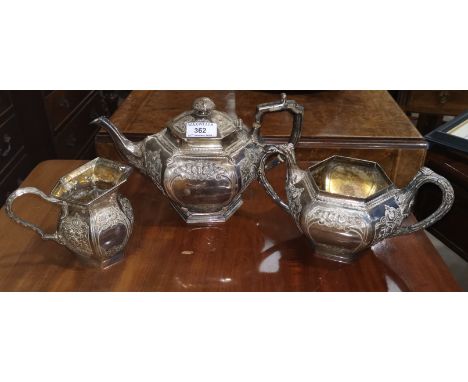 A Victorian silver 3 piece tea service of compressed hexagonal form, with applied and repousse decoration, Dublin 1871, 50 oz