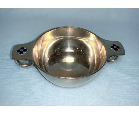 A silver porringer with loop handles and applied blue enamel flowers, Liberty &amp; Co, Birmingham 1909, 5 oz 